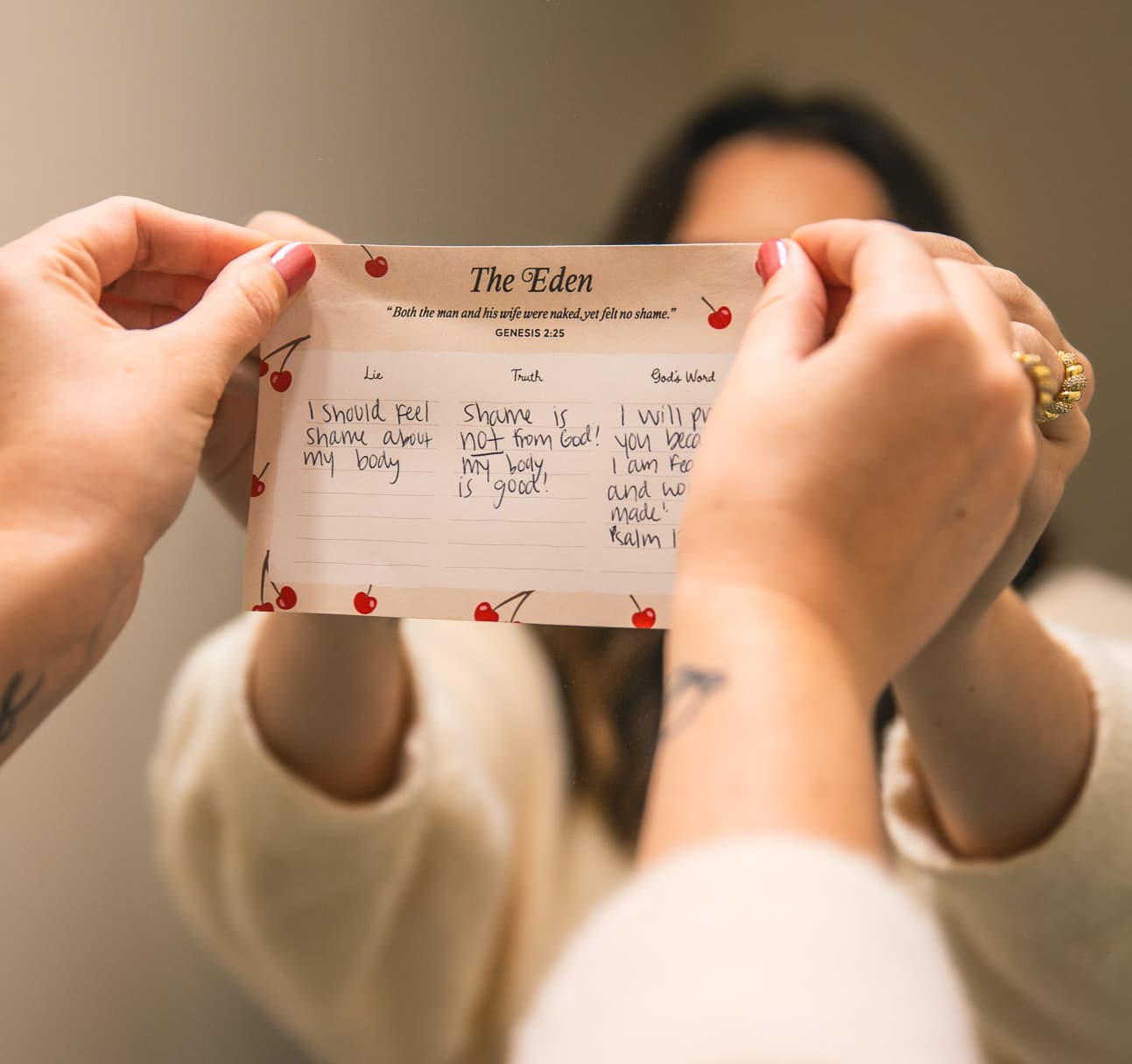 The Eden sticky note held up in a mirror